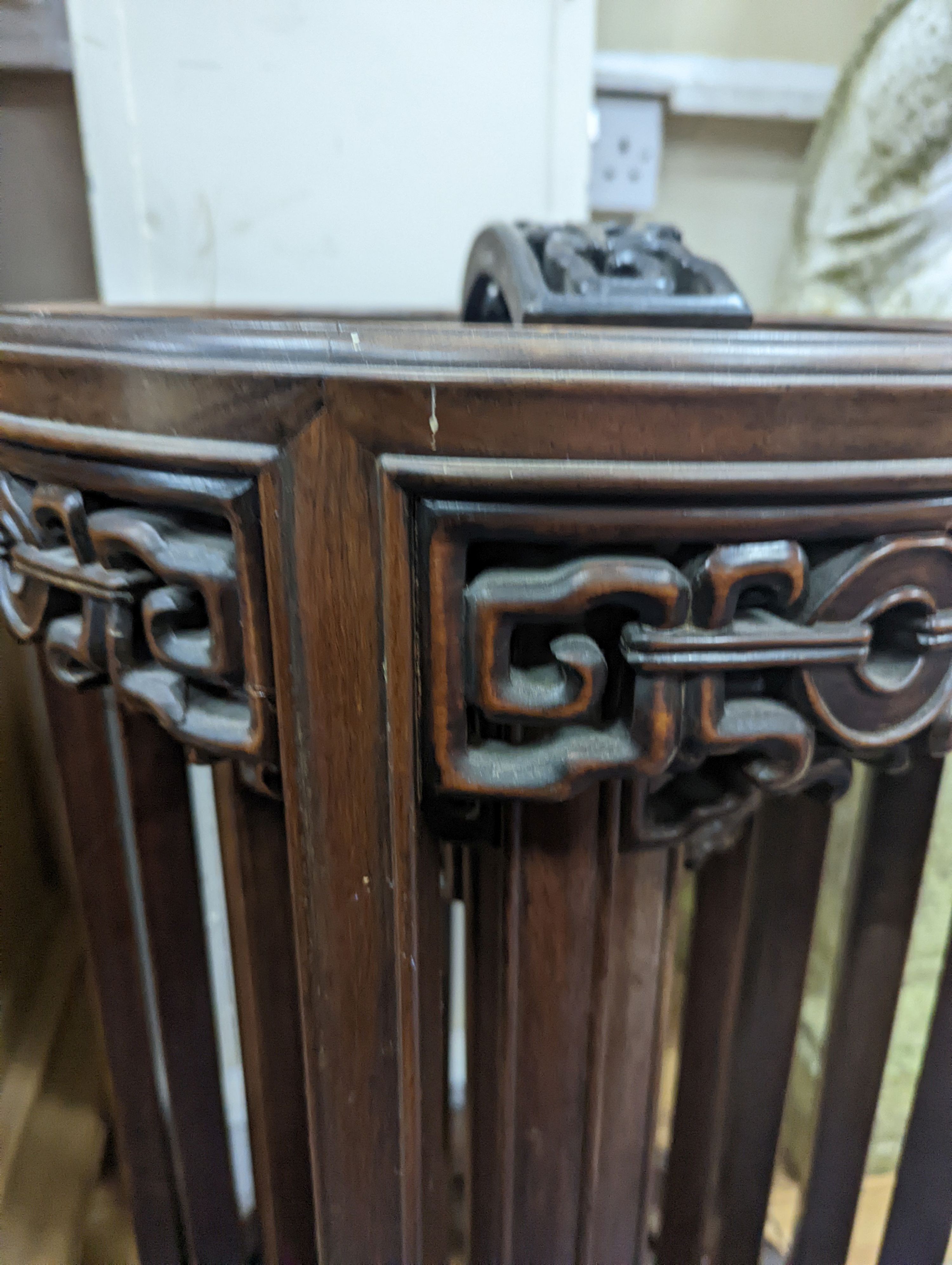A nest of four Chinese hardwood circular tables, largest diameter 40cm, height 67cm